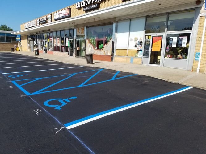 A parking lot with blue lines on the ground.