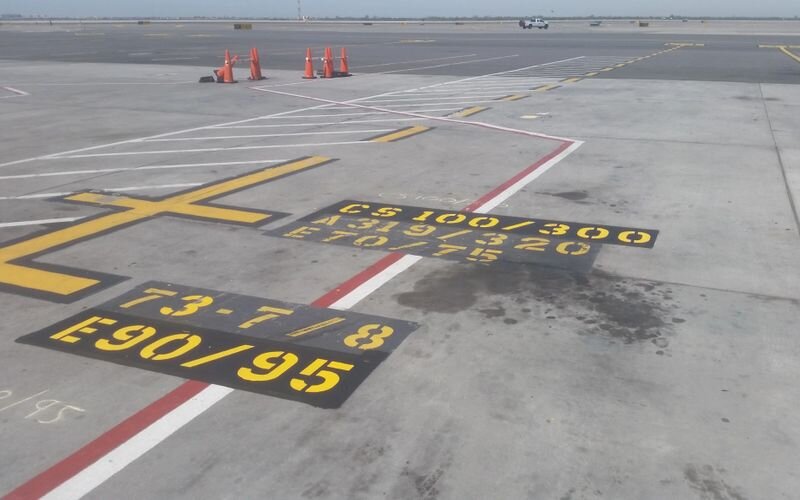 A runway with numbers painted on it.