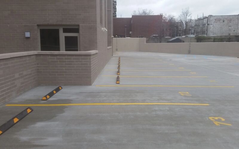 A parking lot with yellow lines on the side of it.