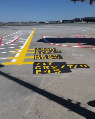 A runway with markings painted on it.