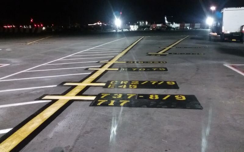 A parking lot with numbers painted on it.