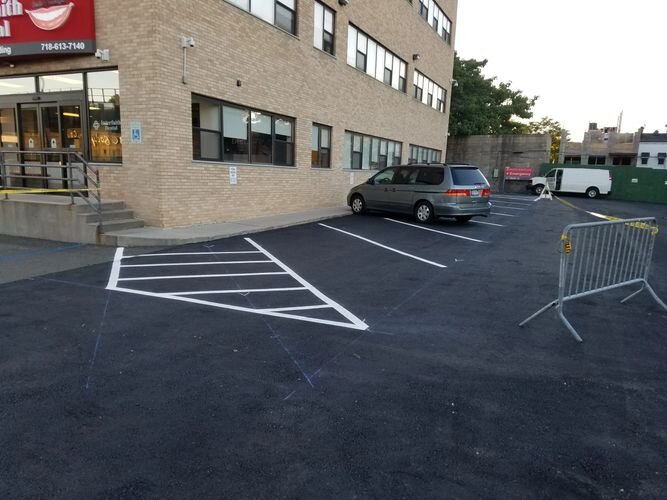 A parking lot with cars parked in it.