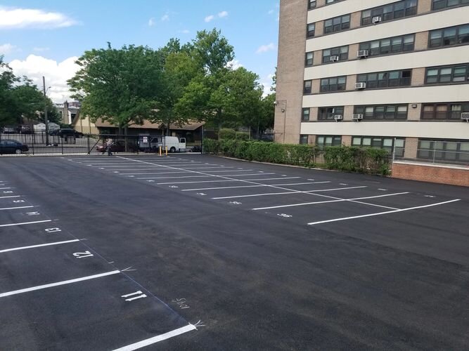 A parking lot with no cars in it.