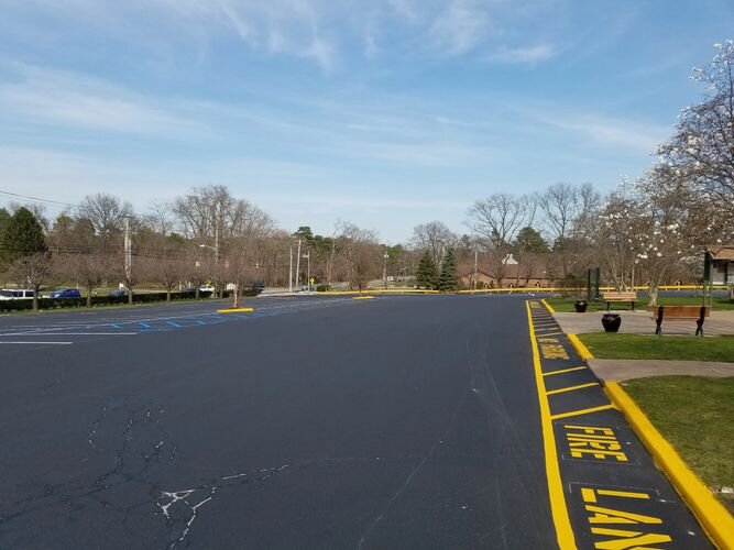 A street with yellow lines on the side of it.