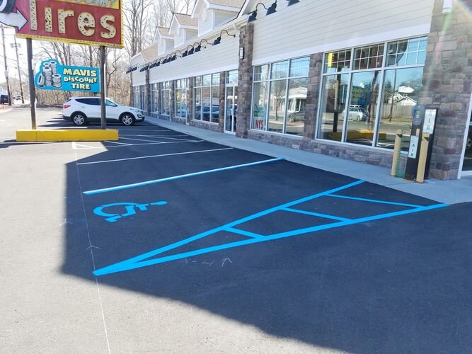 A parking lot with blue lines painted on it.