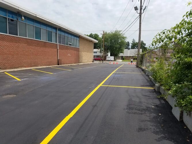 A street with yellow lines on the side of it.