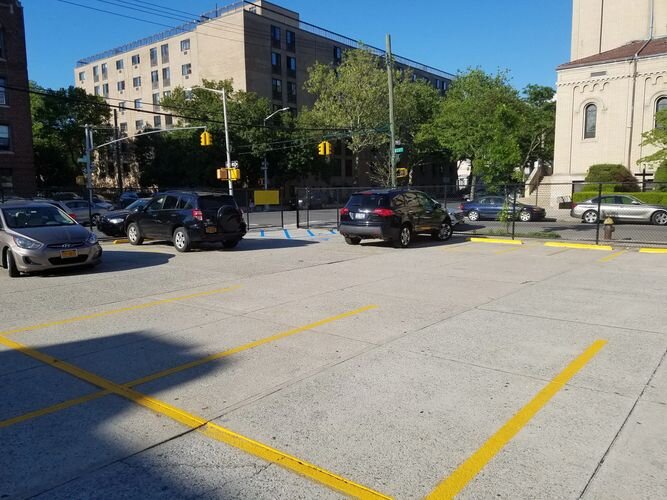 A parking lot with cars parked in it.