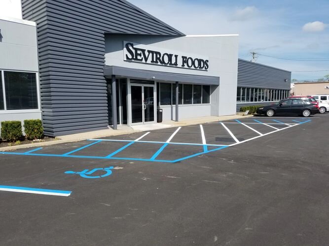 A parking lot with blue lines painted on it.