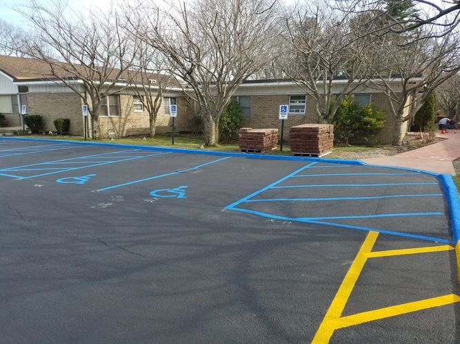 A parking lot with many lines painted on it