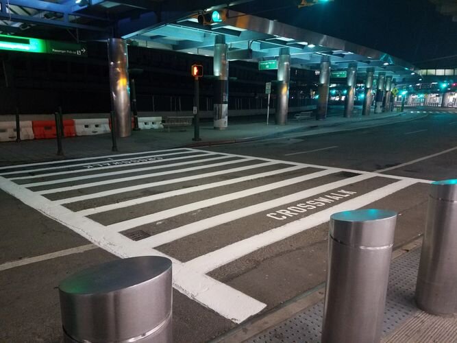 A street with some metal poles on the side of it