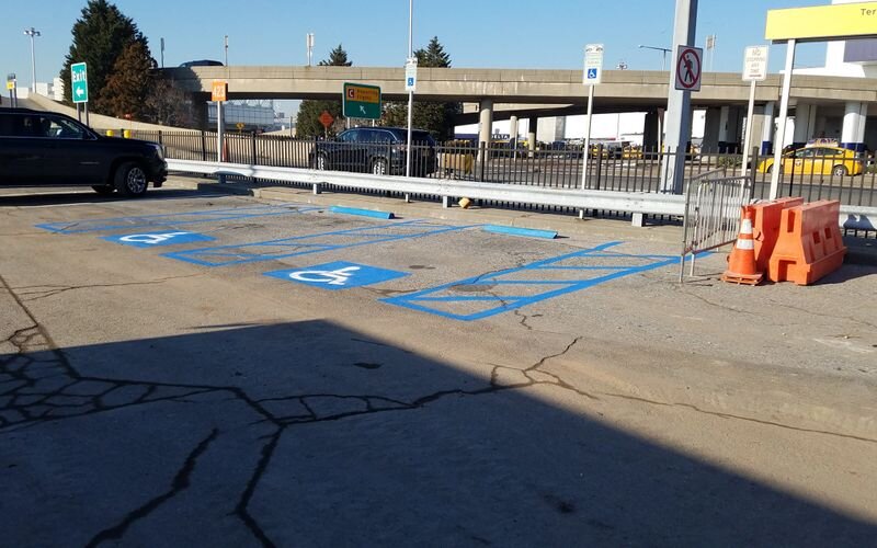 A parking lot with blue lines painted on it.