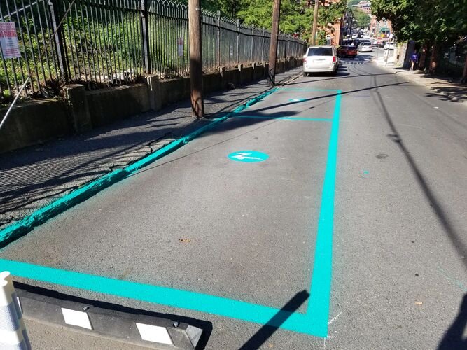 A street with blue lines painted on it.